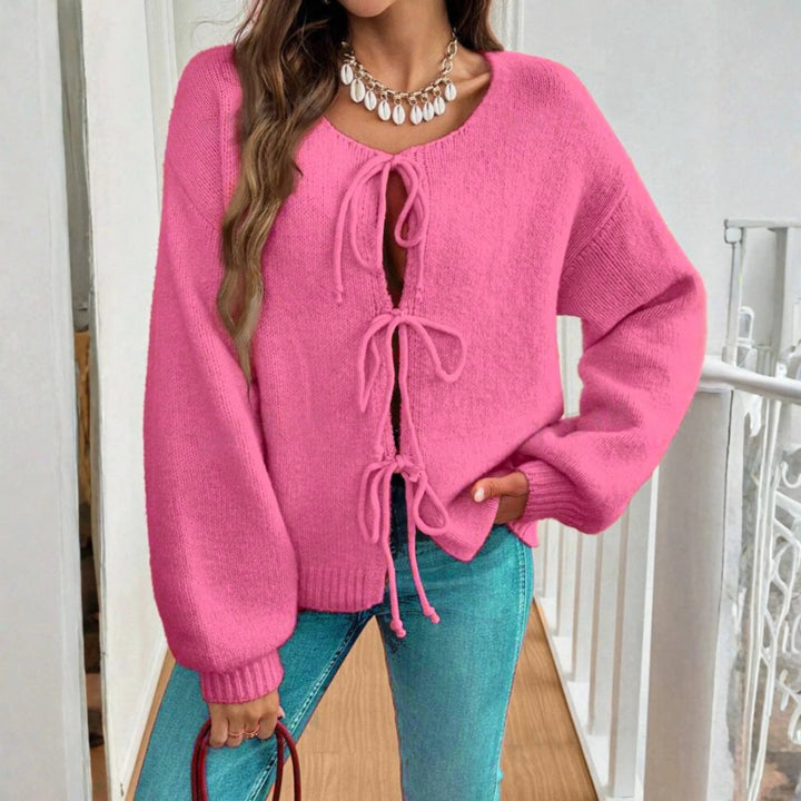 Pink strikcardigan med sløjfer
